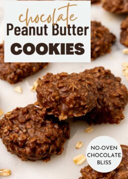 Chocolate and peanut butter no bake cookies arranged on a rustic white surface.