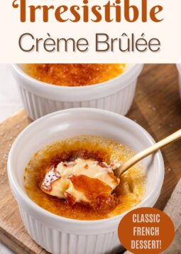 A spoonful of creamy vanilla custard from a freshly torched crème brûlée, showing its silky texture.