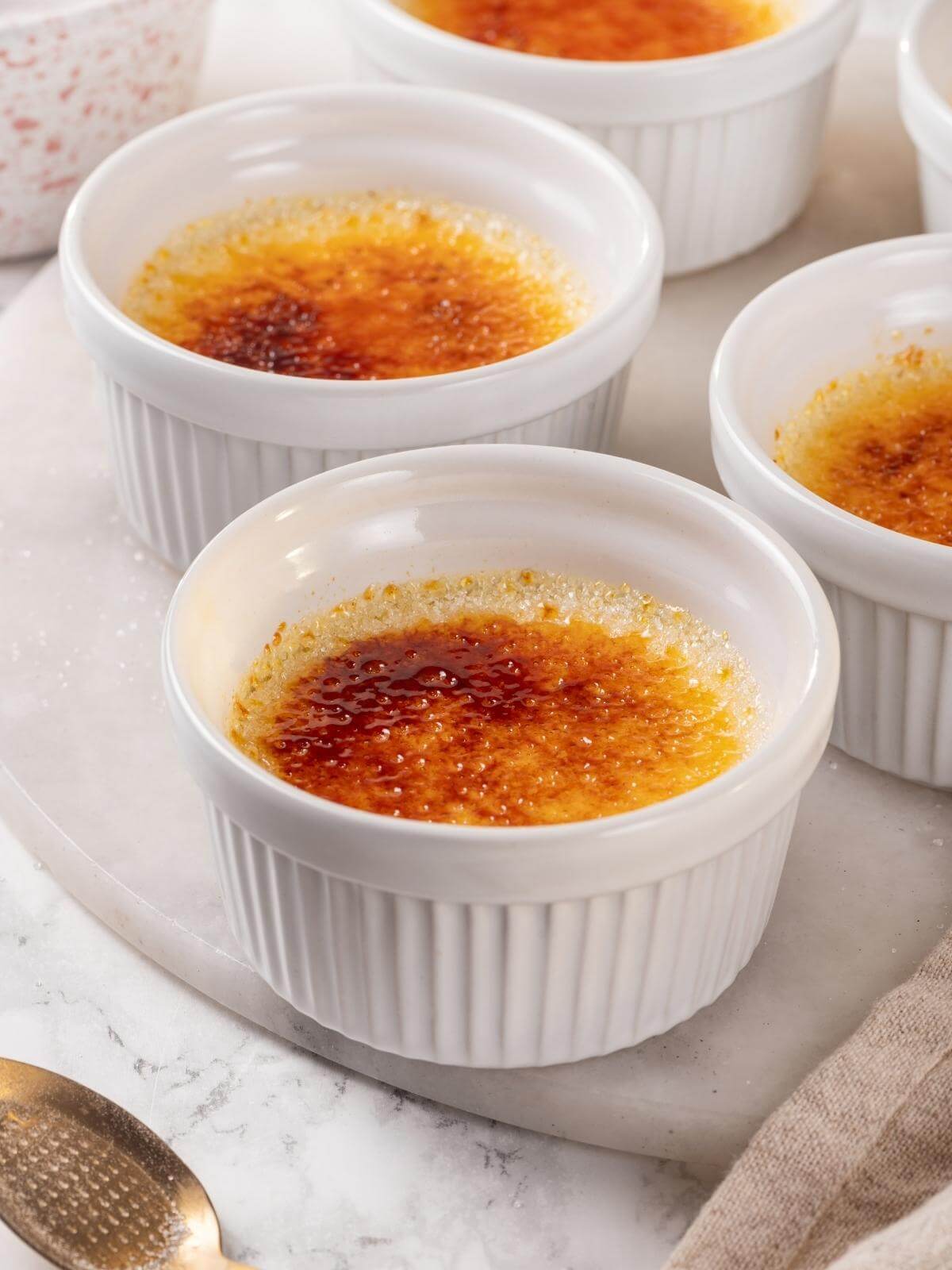 A creme brulee dessert that has set perfectly, with a smooth custard texture.