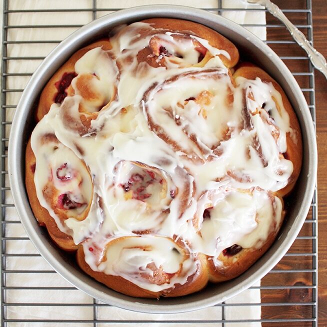 baked raspberry sweet rolls in pan cream cheese icing.