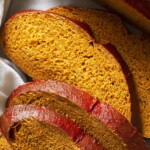 tomato basil bread sliced for sandwiches.