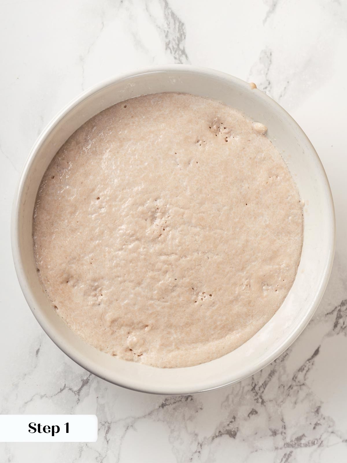 Yeast mixture beginning to bloom in warm milk.