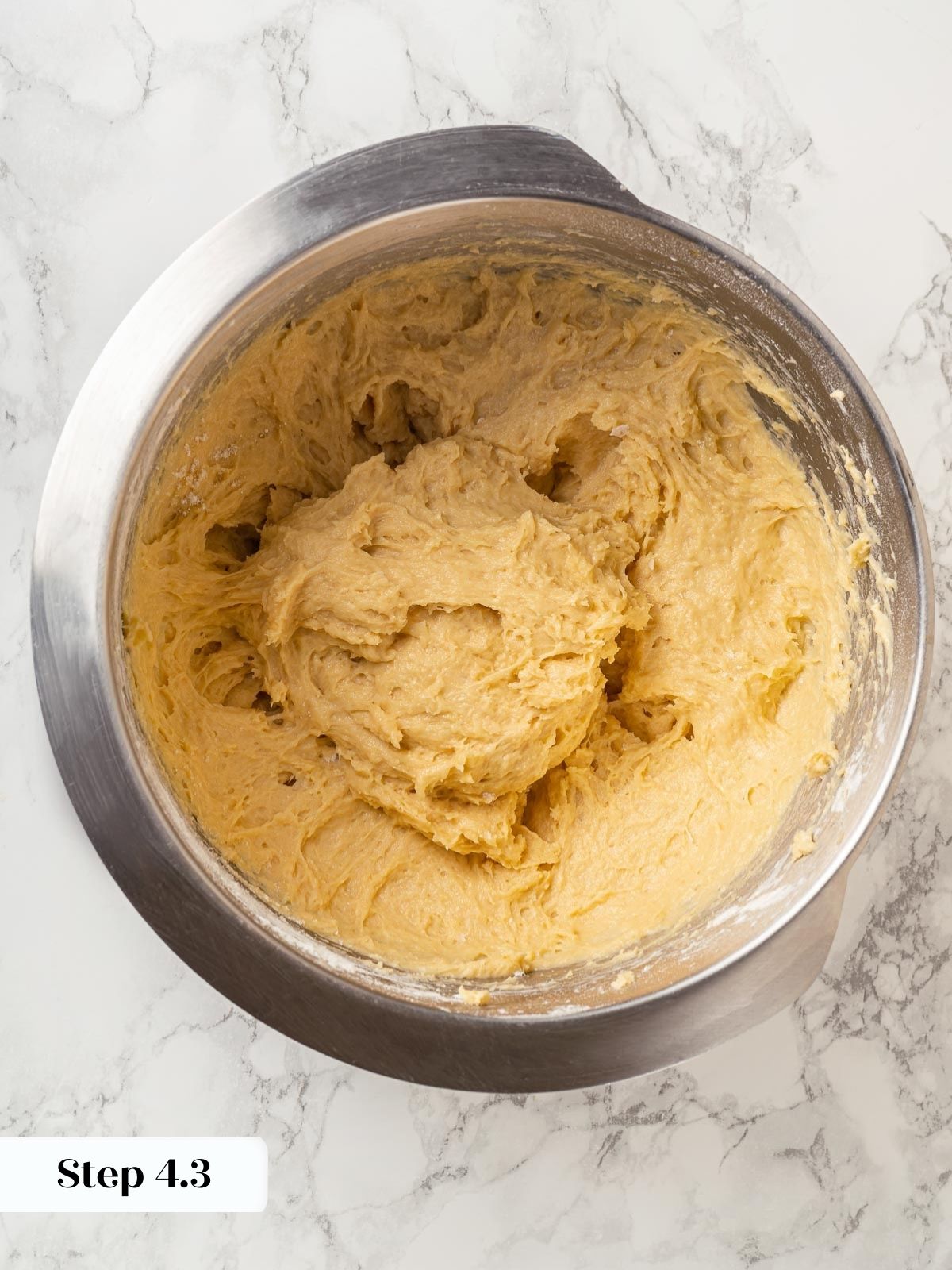 Dough fully mixed in mixing bowl.