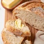 Sourdough slice generously spread with softened butter.