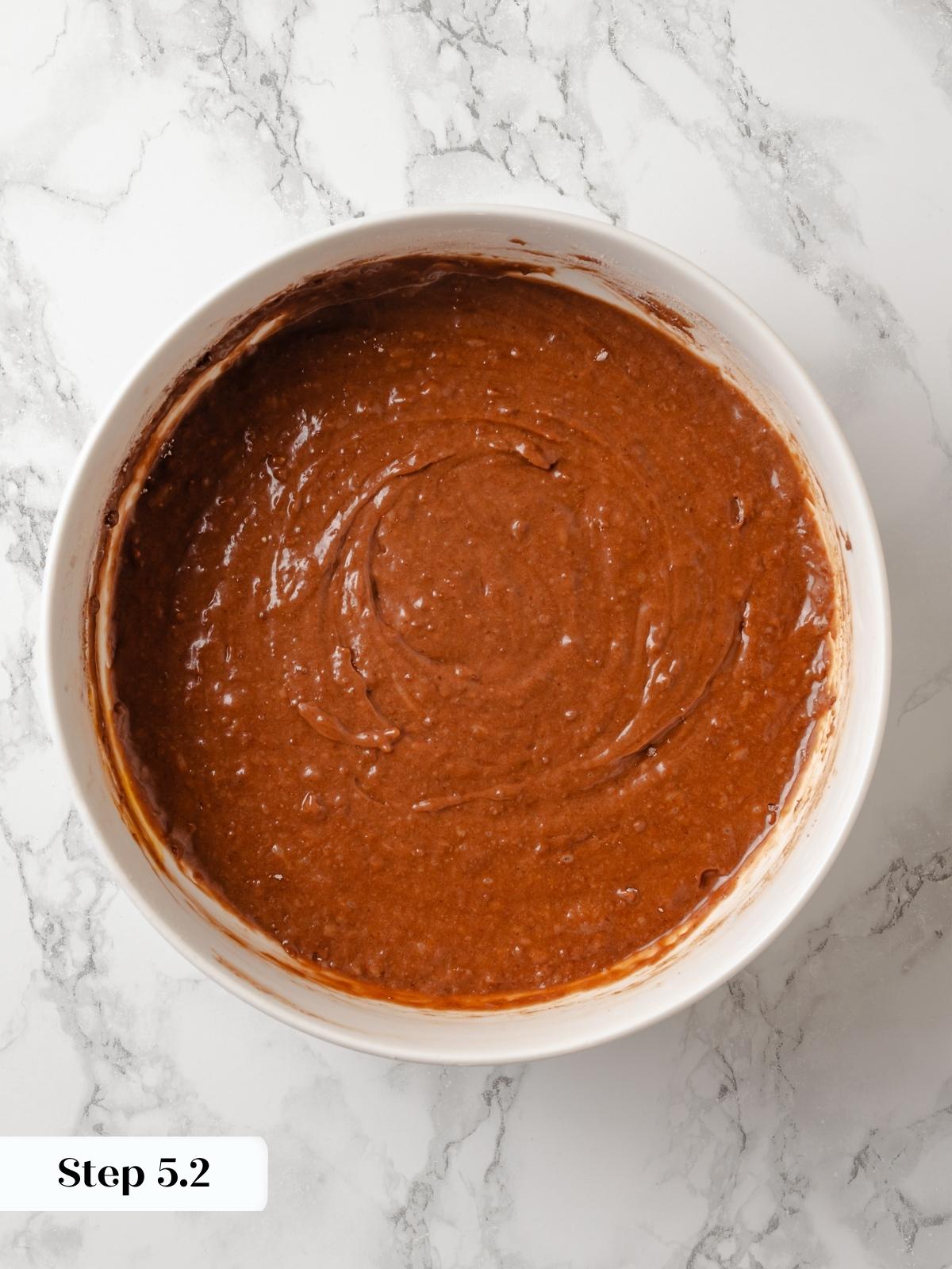 Chocolate donut batter ready in the bowl before piping into pans for baking.
