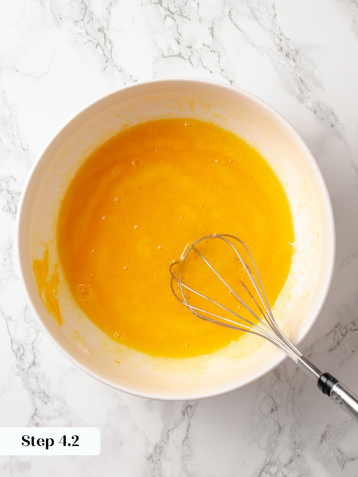 Smooth, well-beaten egg and sugar mixture forms the base for soft chocolate donut batter.