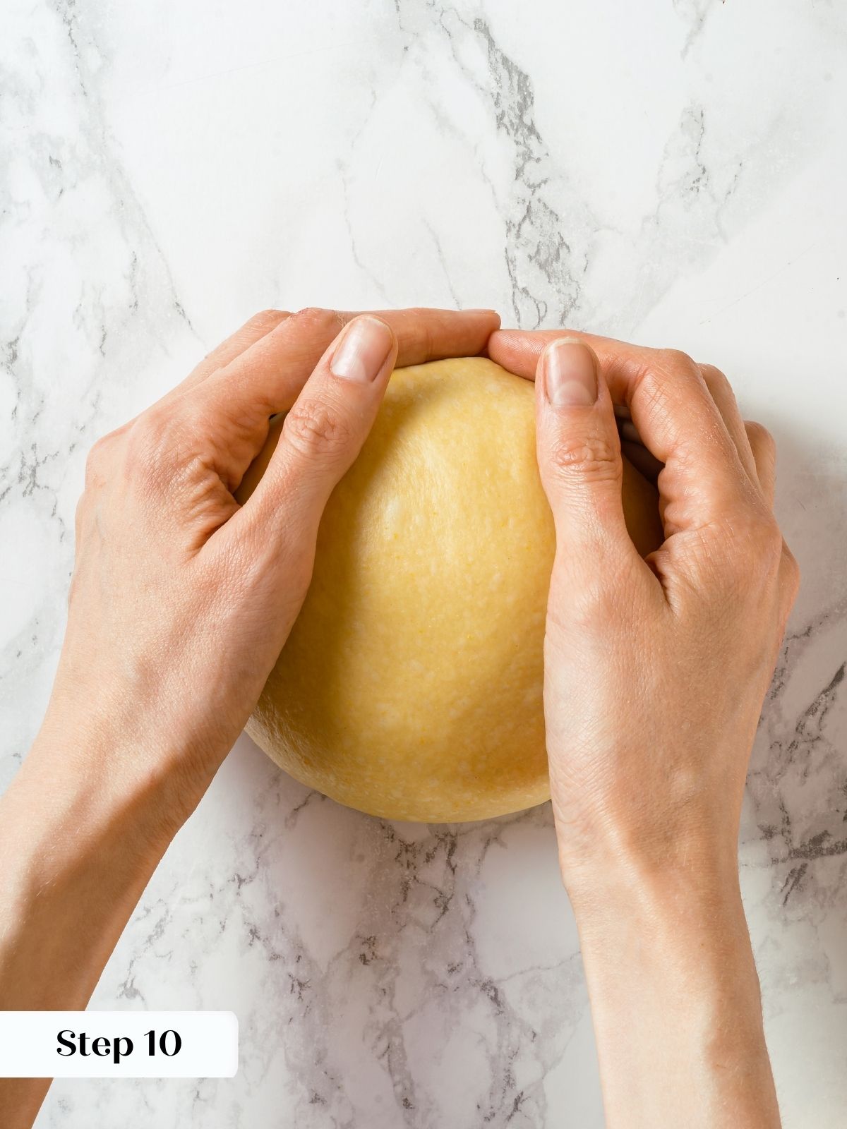 Shaped boule of cinnamon bread dough with smooth top, ready for final bench rest.