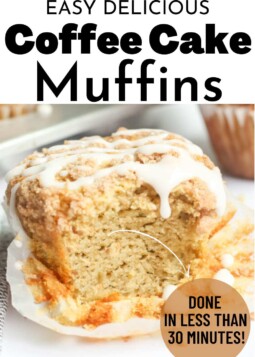Muffin with lines of white glaze and a bite taken out.