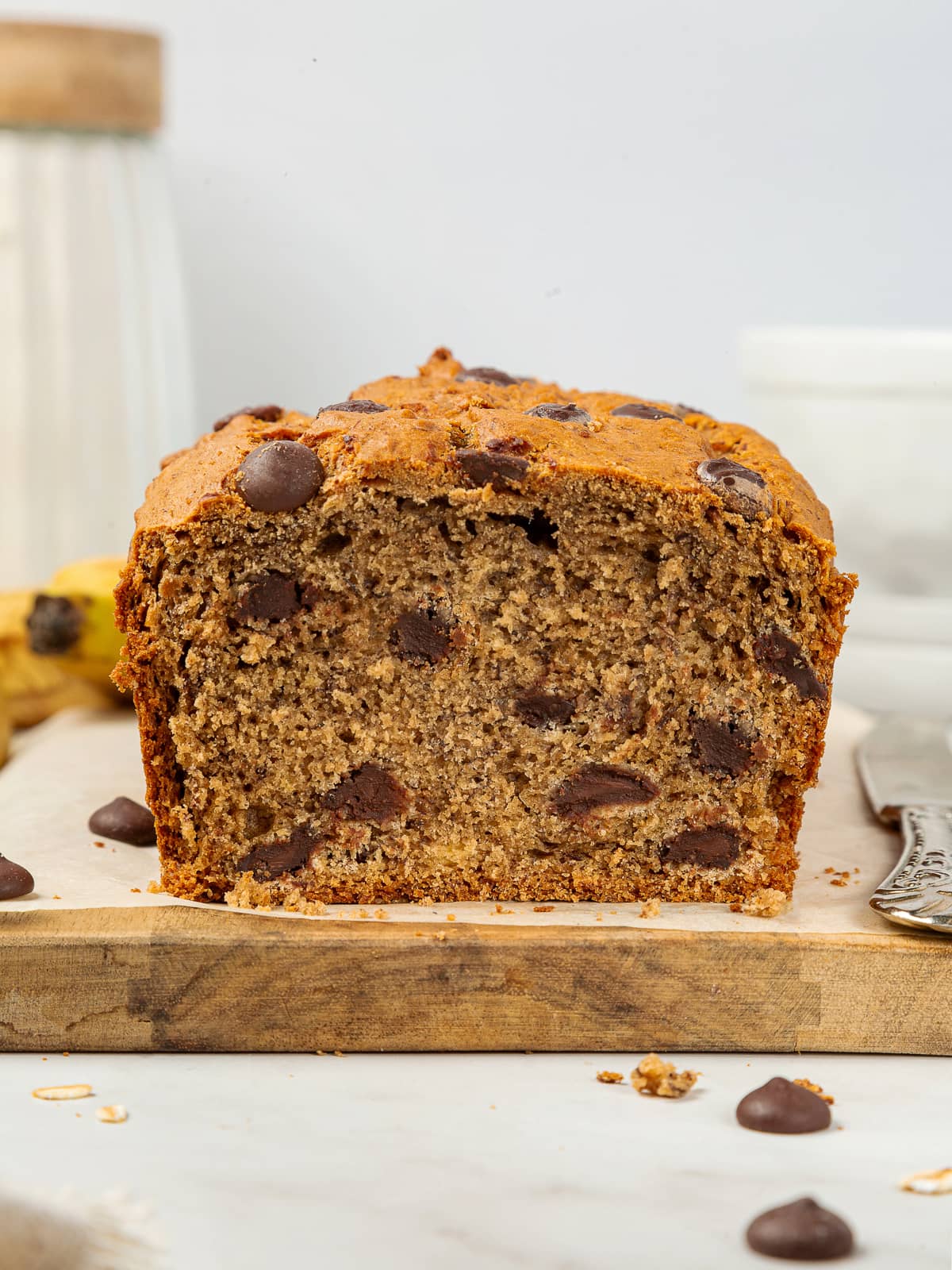 Banana bread loaf filled with chocolate chips that have held their shape during baking.