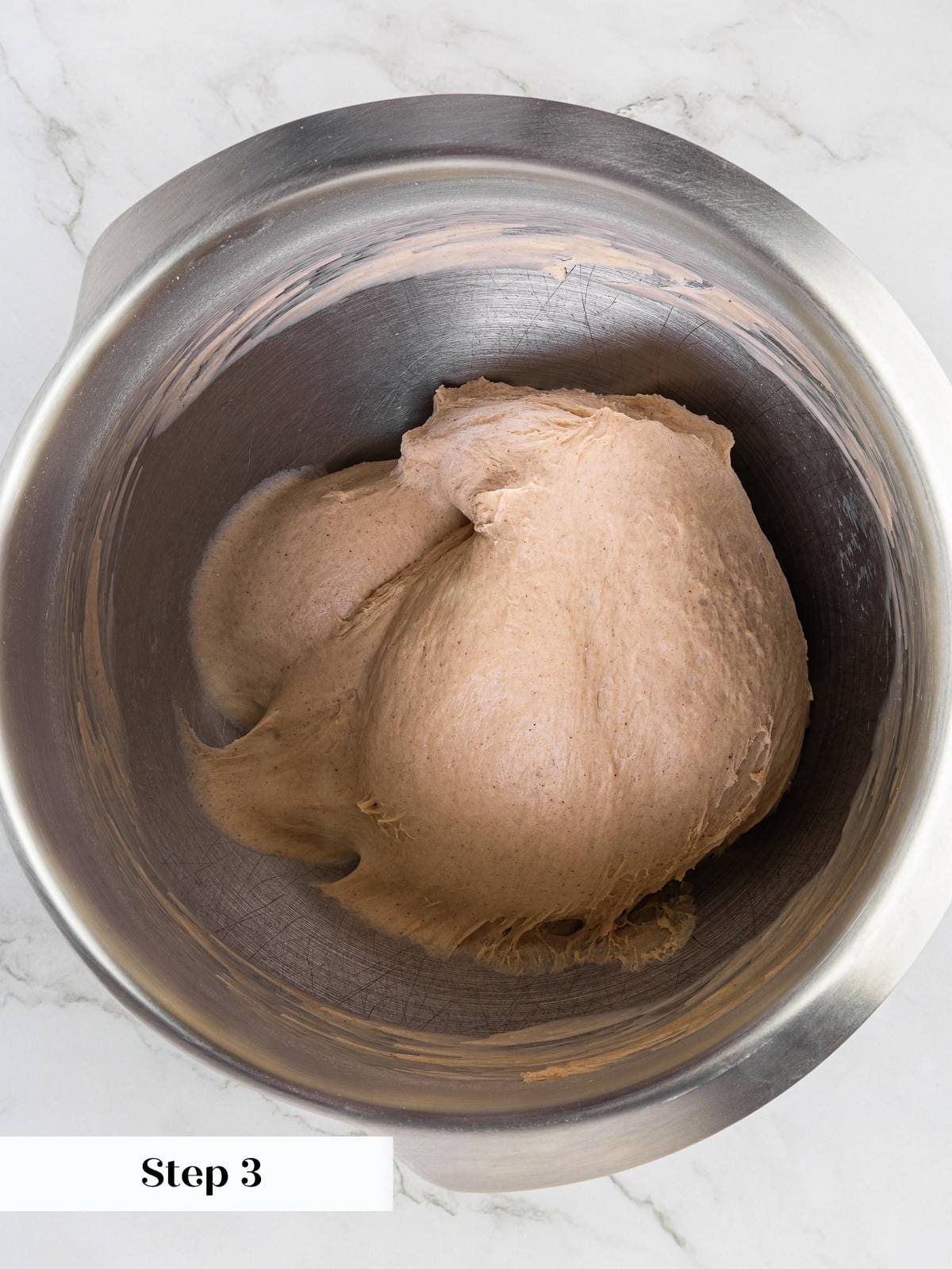 Bagel dough smooth and elastic after full mixing stage, waiting for flavor mix-ins.