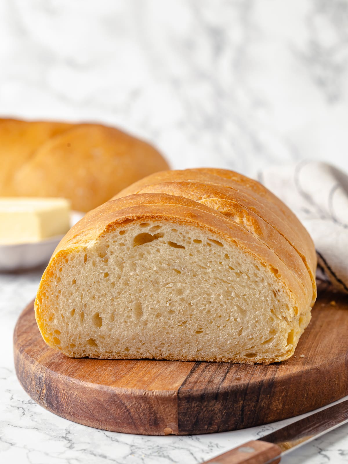 Inside of loaf shows soft, consistent crumb with even texture and tender bite.