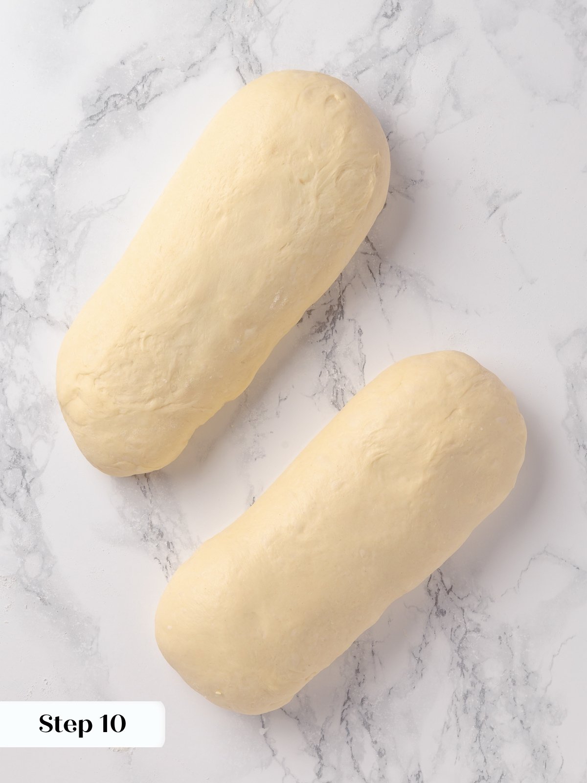 Dough shaped into a b&acirc;tard with tapered ends, ready to proof before baking.
