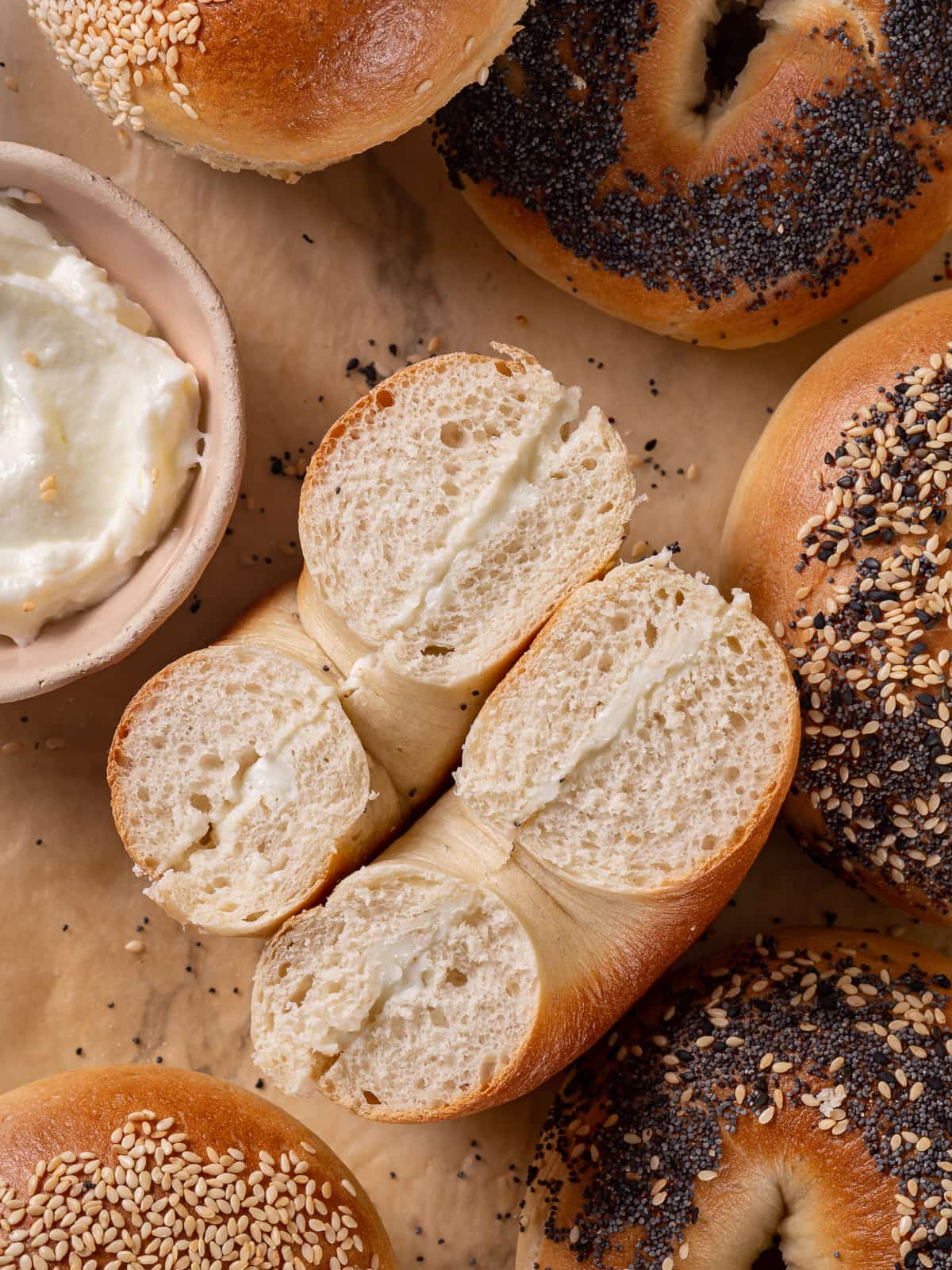 Sourdough discard bagel sliced and generously spread with whipped cream cheese.