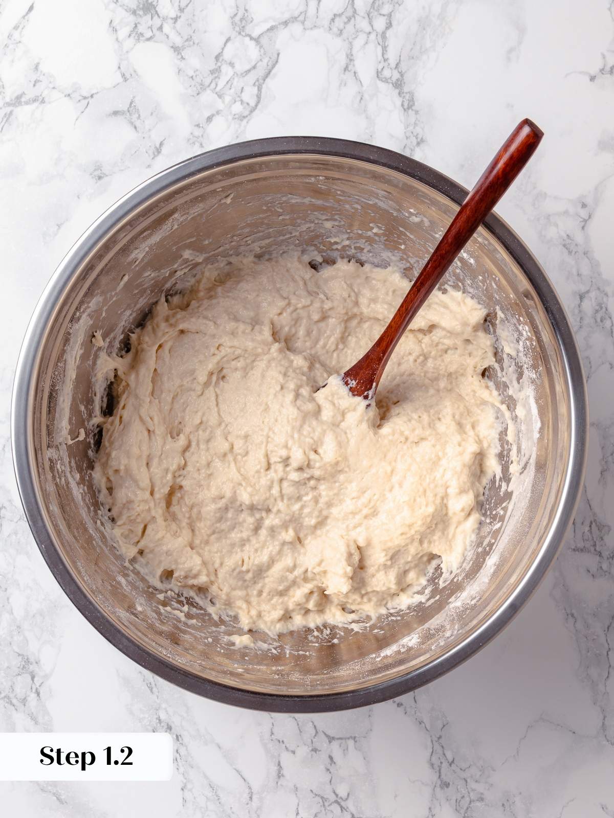 Shaggy cheese bread dough right after mixing, before cheese and rising steps.