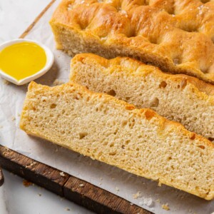 Sliced focaccia highlighting its fluffy inside and perfectly chewy bread crumb texture.