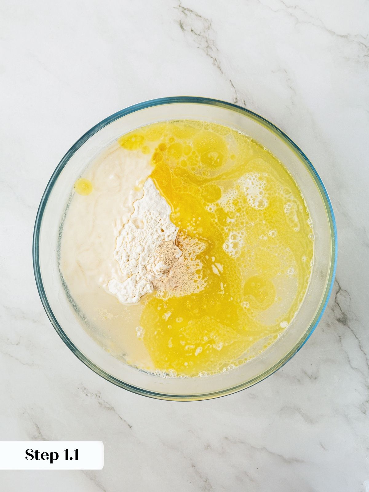 Mixing flour, water, yeast, and olive oil together to begin focaccia dough.