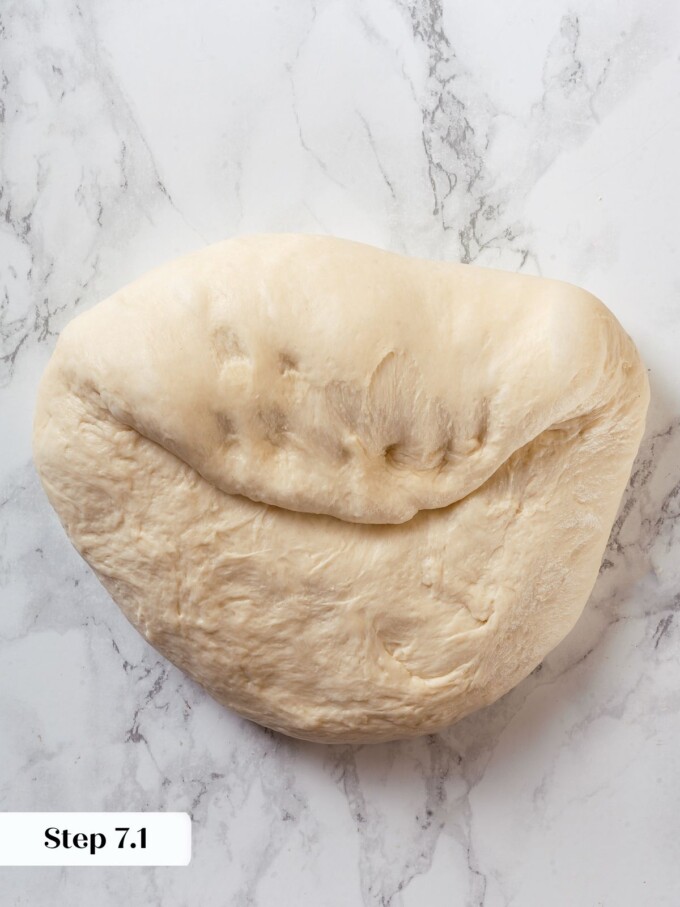 Dough folded one third of the way down, part of sourdough shaping process.