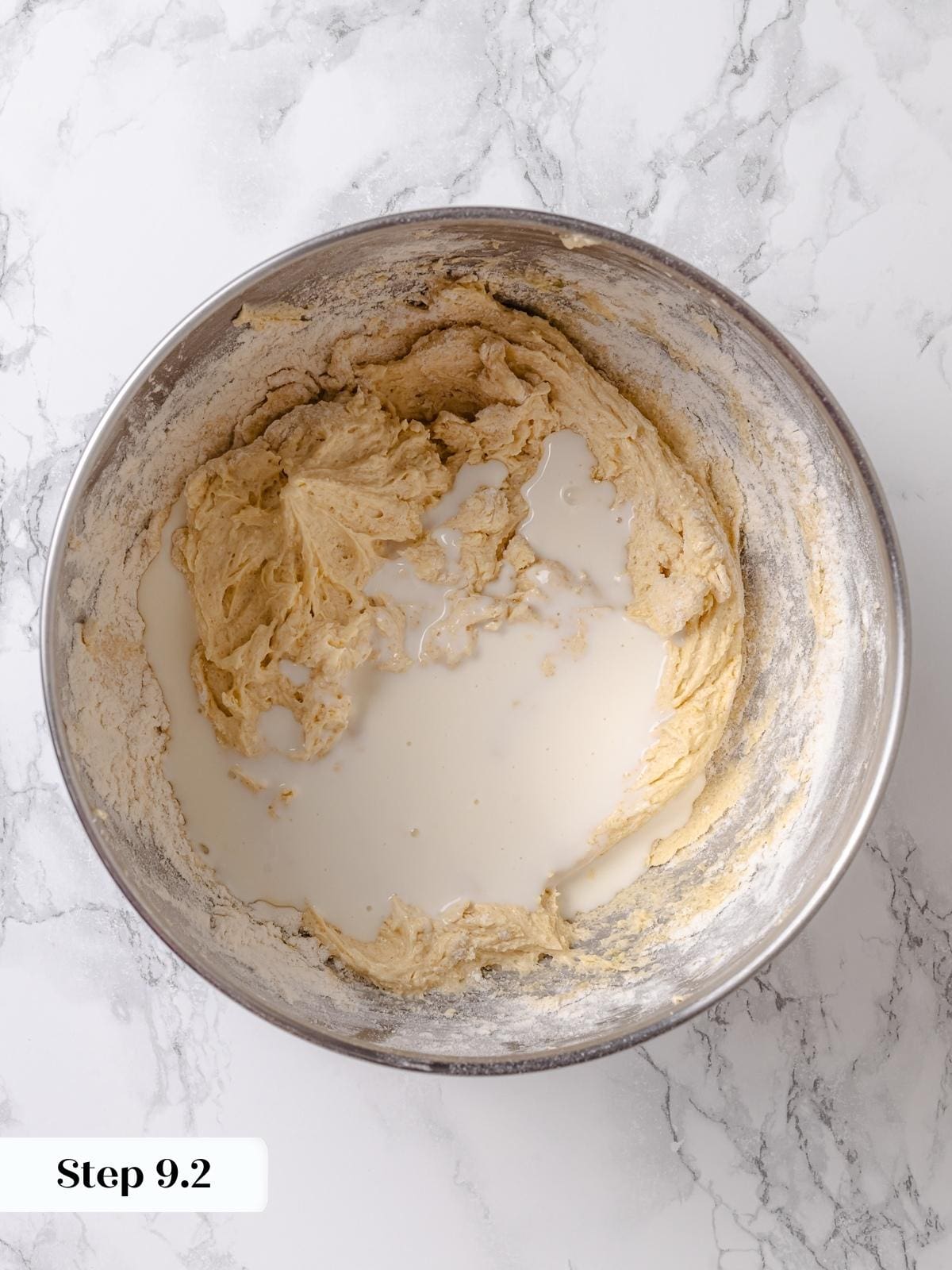 Ingredients being poured into mixing bowl while preparing apple coffee cake batter.