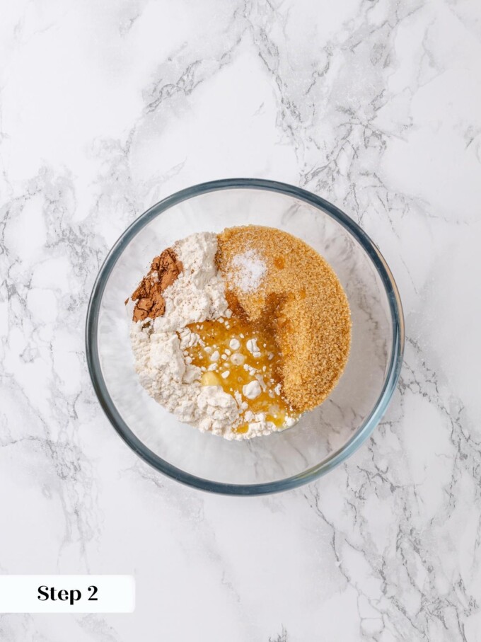 Bowl containing brown sugar, flour, and butter for apple coffee cake crumb topping.