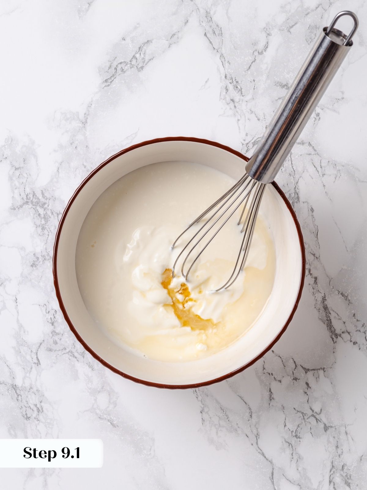 Milk and vanilla being whisked together as part of apple coffee cake batter mixture.