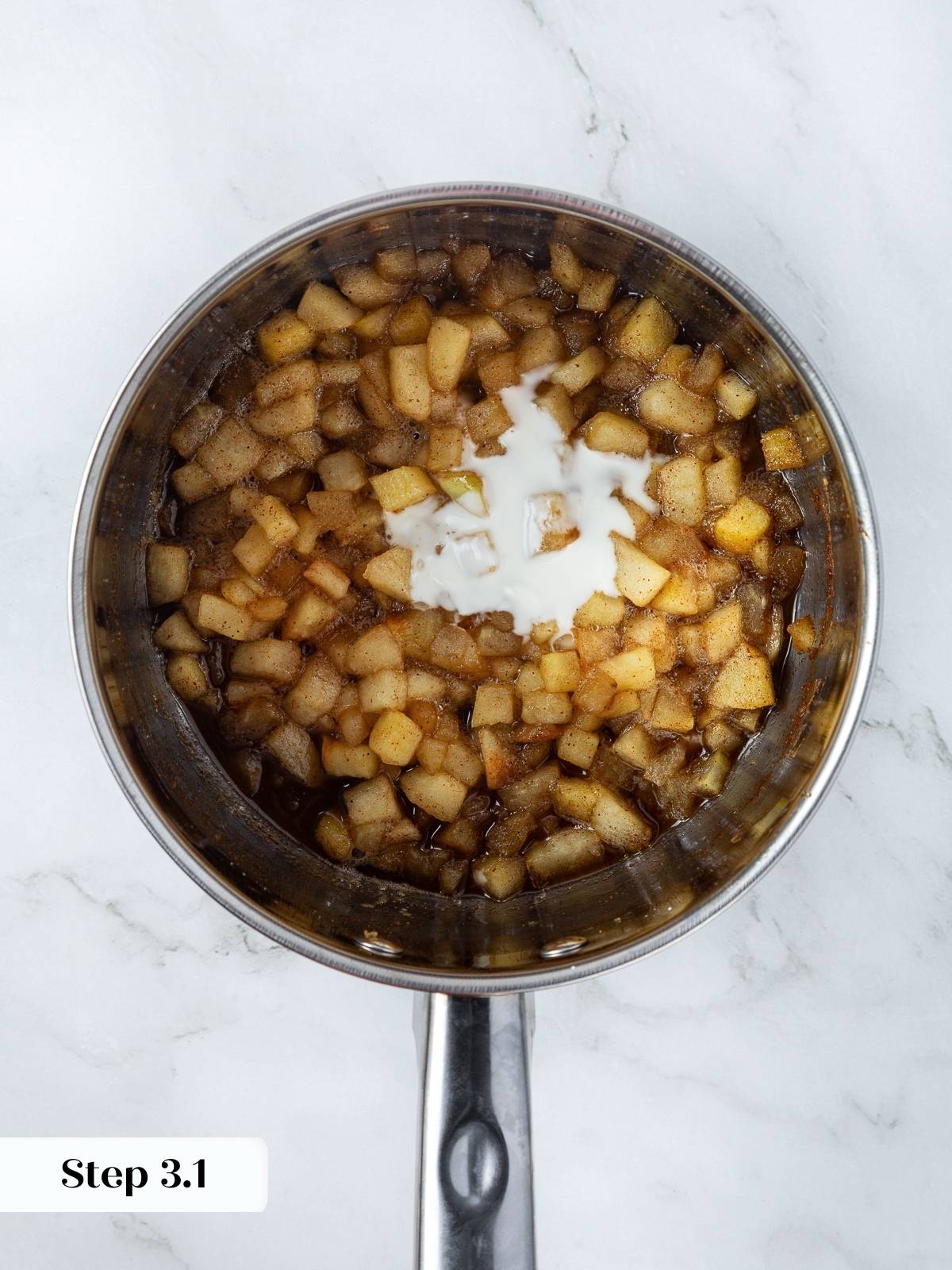 Cornstarch slurry added to apples in saucepan, thickening filling for puff pastry turnovers.