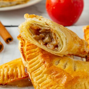Sweet spiced apple filling in turnovers, with visible apple chunks coated in sugar and cinnamon.