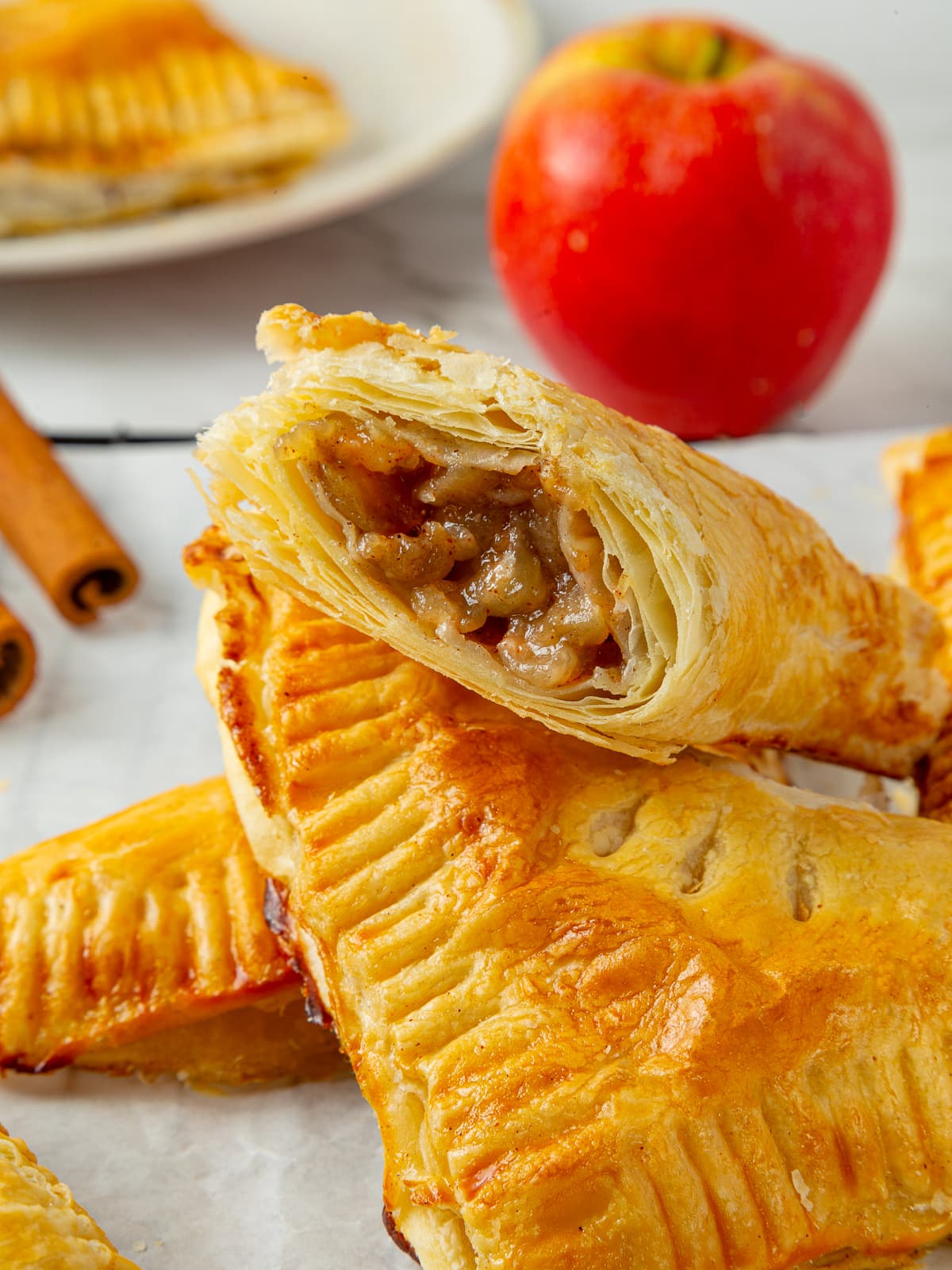 Sweet spiced apple filling in turnovers, with visible apple chunks coated in sugar and cinnamon.