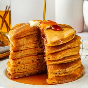 Cross section of pumpkin pancake showing the fluffy interior, moist and golden from cooking.