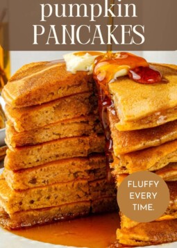 Golden brown pumpkin pancakes piled high on a plate, ready for a cozy family weekend breakfast.