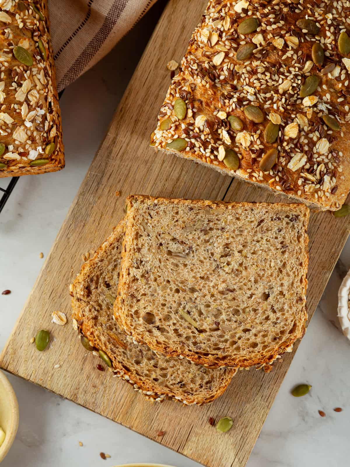 Bread loaf topped generously with seeds for hearty crunch.