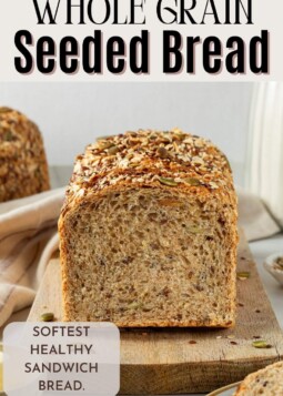 Hearty whole grain bread speckled with pumpkin, sunflower, and flax seeds, sliced for easy meals.