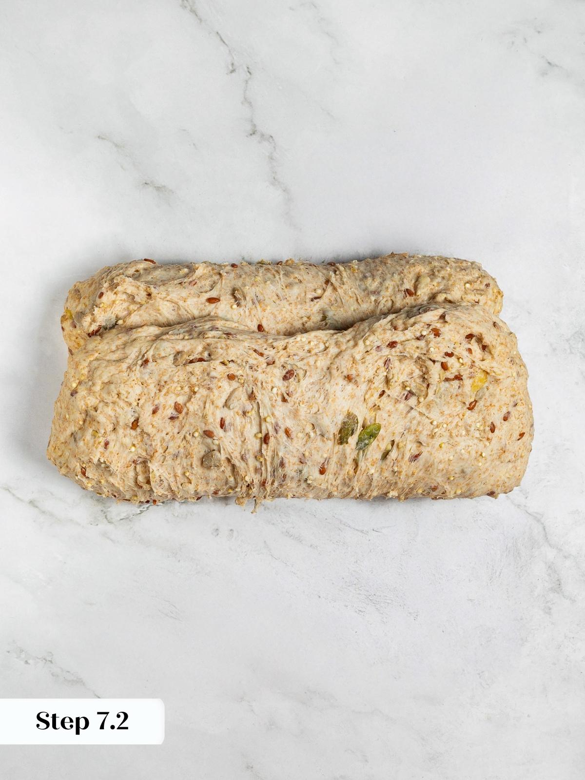 Dough rolled into tight log for sandwich bread loaf.