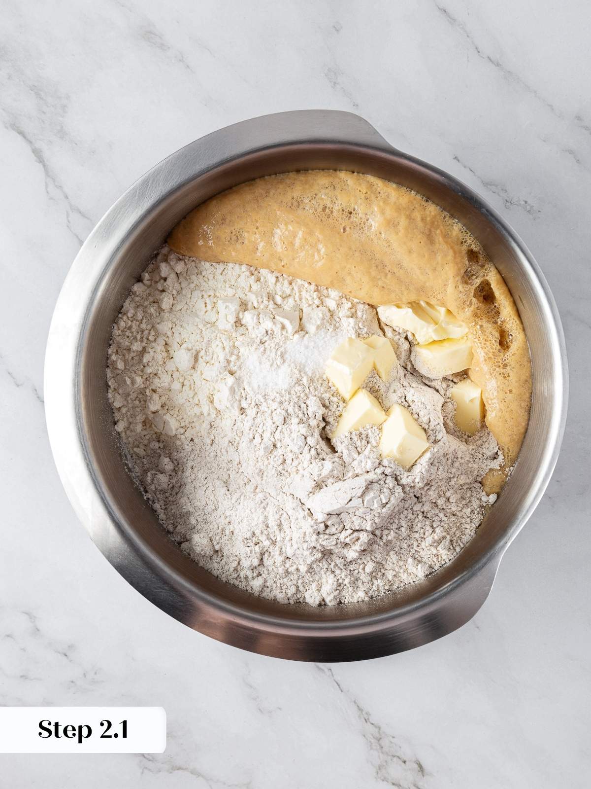 Combining ingredients for marble rye bread including butter, flour, and yeast mixture.