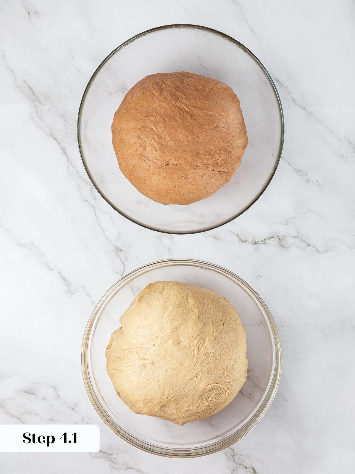 Two bowls of just-kneaded rye dough before rising, one plain and one darkened with cocoa.
