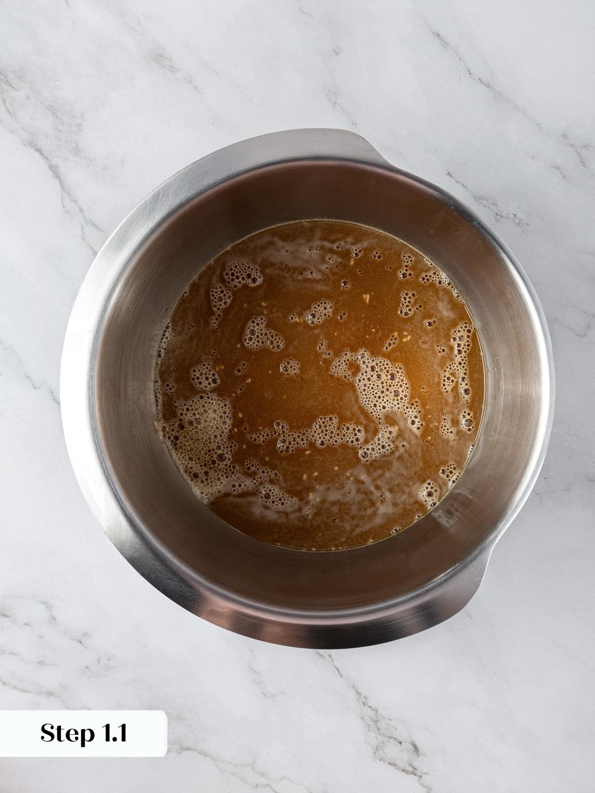 Molasses and yeast combined with warm water forming the base of the marble rye dough.