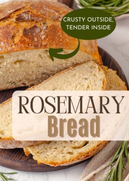 Artisan rosemary loaf resting on cutting board, showing its crispy crust and fluffy interior.