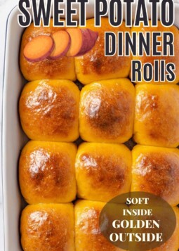 Golden brown sweet potato dinner rolls brushed with brown butter and ready to serve for dinner.