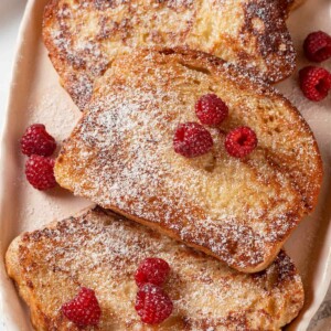Thick slices of French toast with a soft, airy texture and golden brown color.