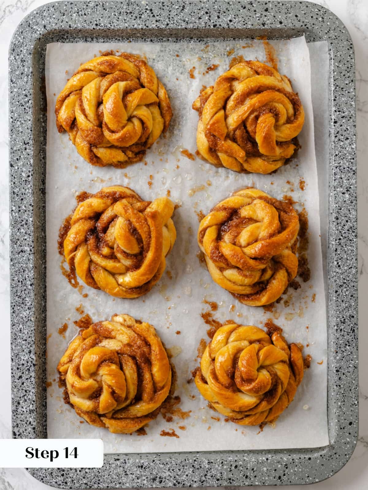 Baked buns set aside to cool, their twisted shapes firm and golden.