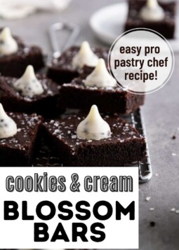 Dark chocolate cookie bar topped with sparkling sugar and a cookies and cream hershey's kiss.