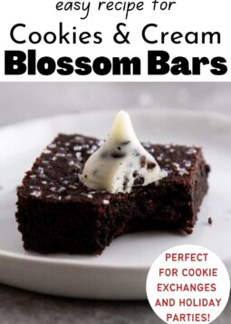 Dark chocolate cookie bar topped with sparkling sugar and a cookies and cream hershey's kiss.