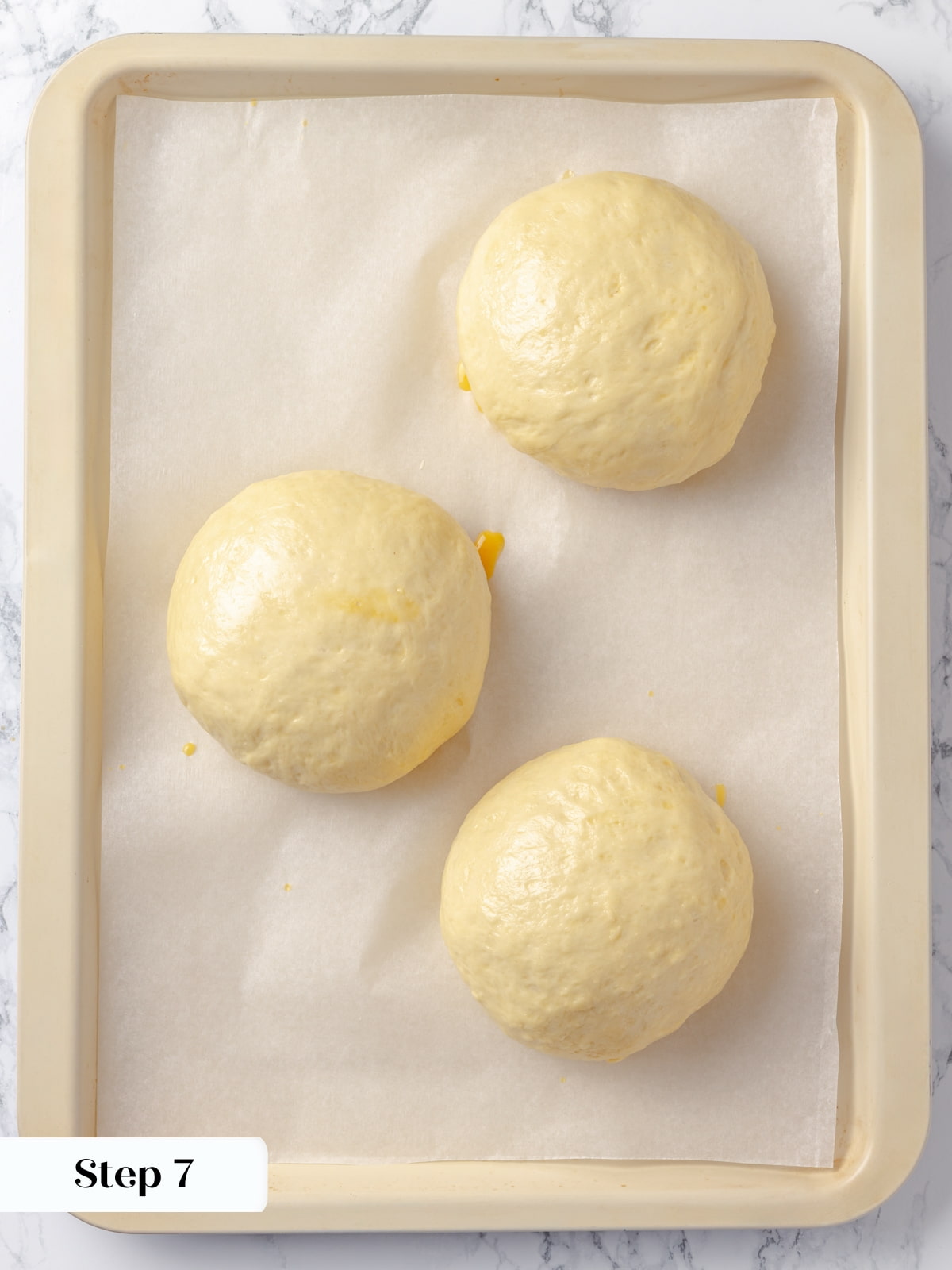 Dough that has doubled during proofing, indicating it is ready for the next step.