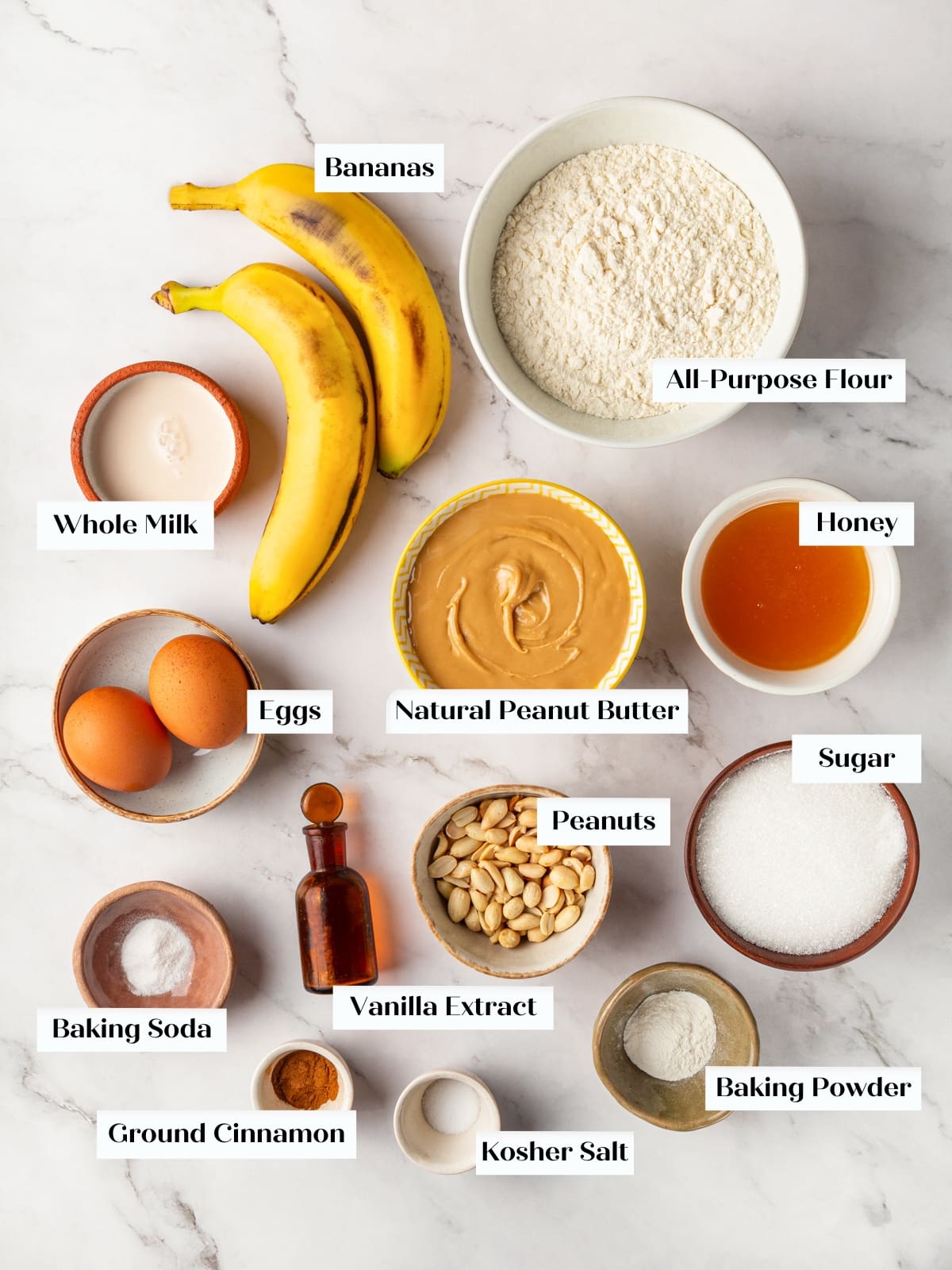 All ingredients for peanut butter banana bread arranged on a countertop for easy preparation.