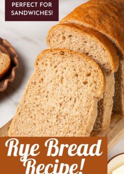 Thick slices of rye bread arranged on a board ready for hearty sandwich fillings.