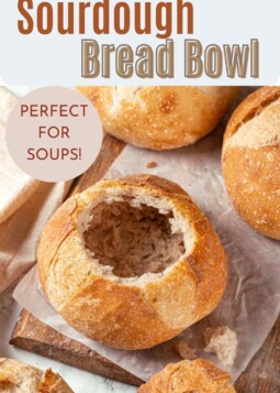 Freshly baked sourdough bread bowls showing strong sides and chewy interior crumb texture.