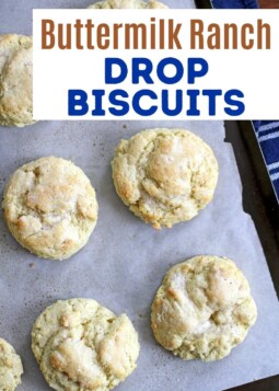 Fluffy buttermilk ranch drop biscuits arranged on parchment.