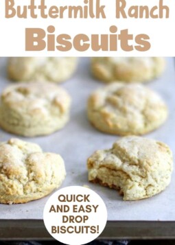 Fluffy buttermilk ranch drop biscuits arranged on parchment.