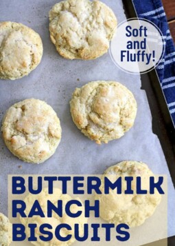 Fluffy buttermilk ranch drop biscuits arranged on parchment.