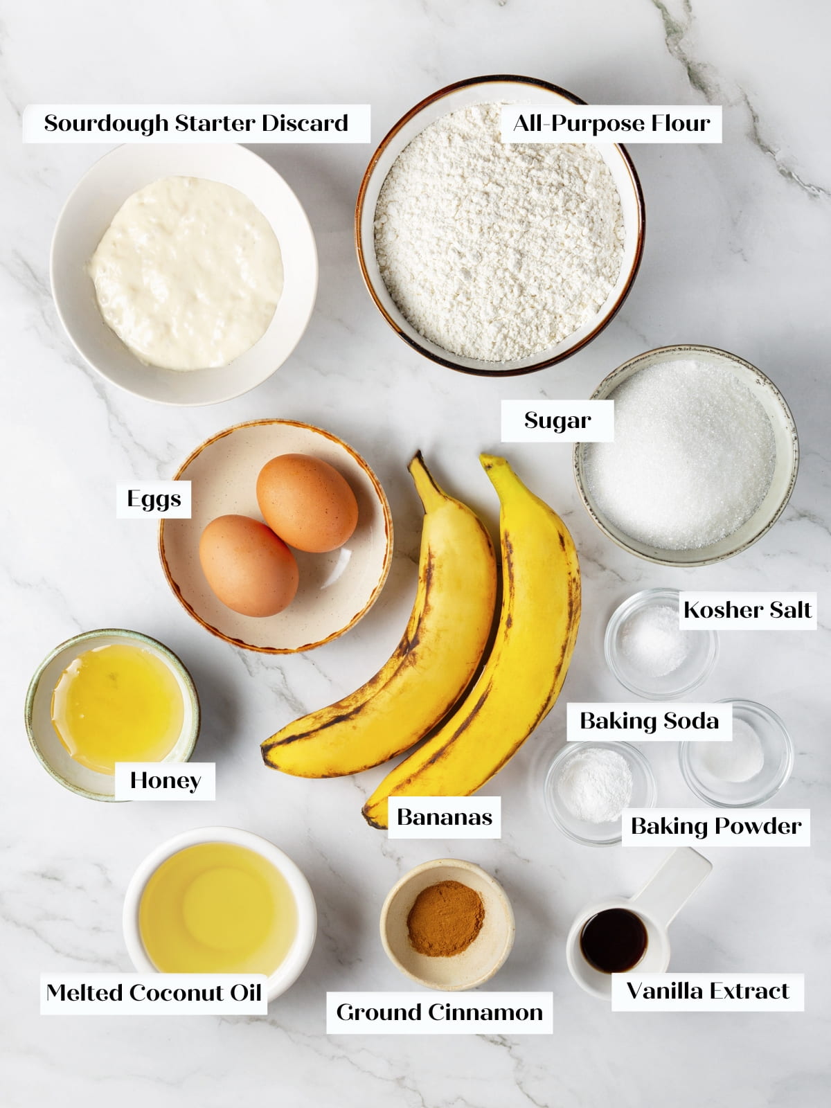 Ingredients for sourdough banana bread arranged on kitchen countertop before mixing.