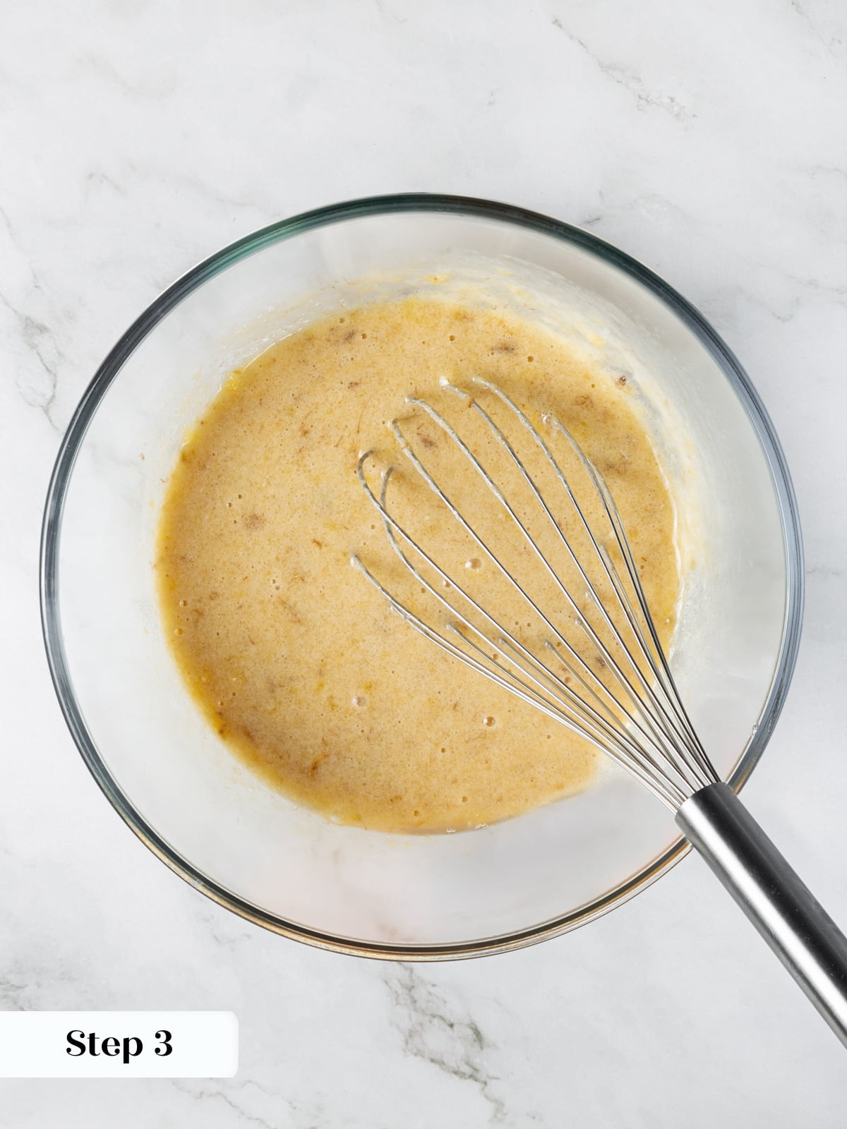 Wet ingredients combined smoothly for sourdough banana bread batter.